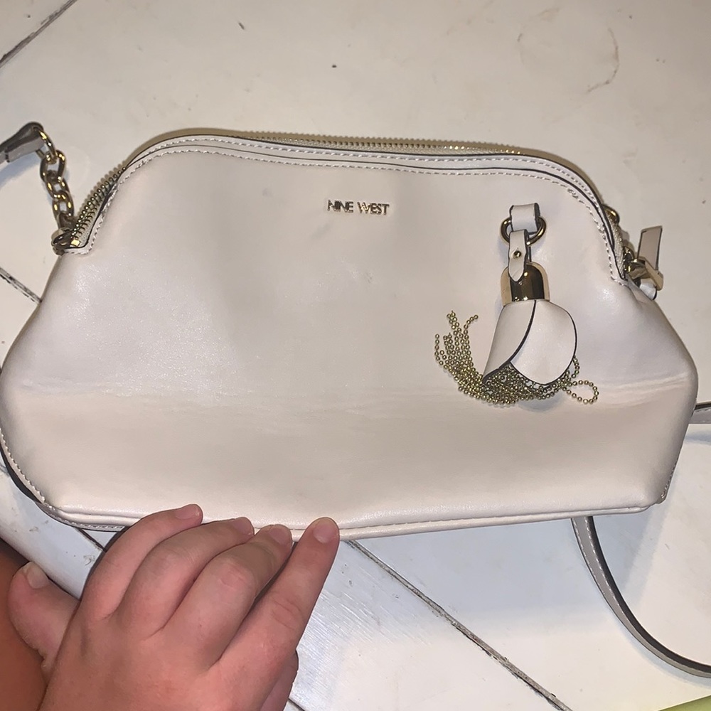 nine west off white purse with a potable strap